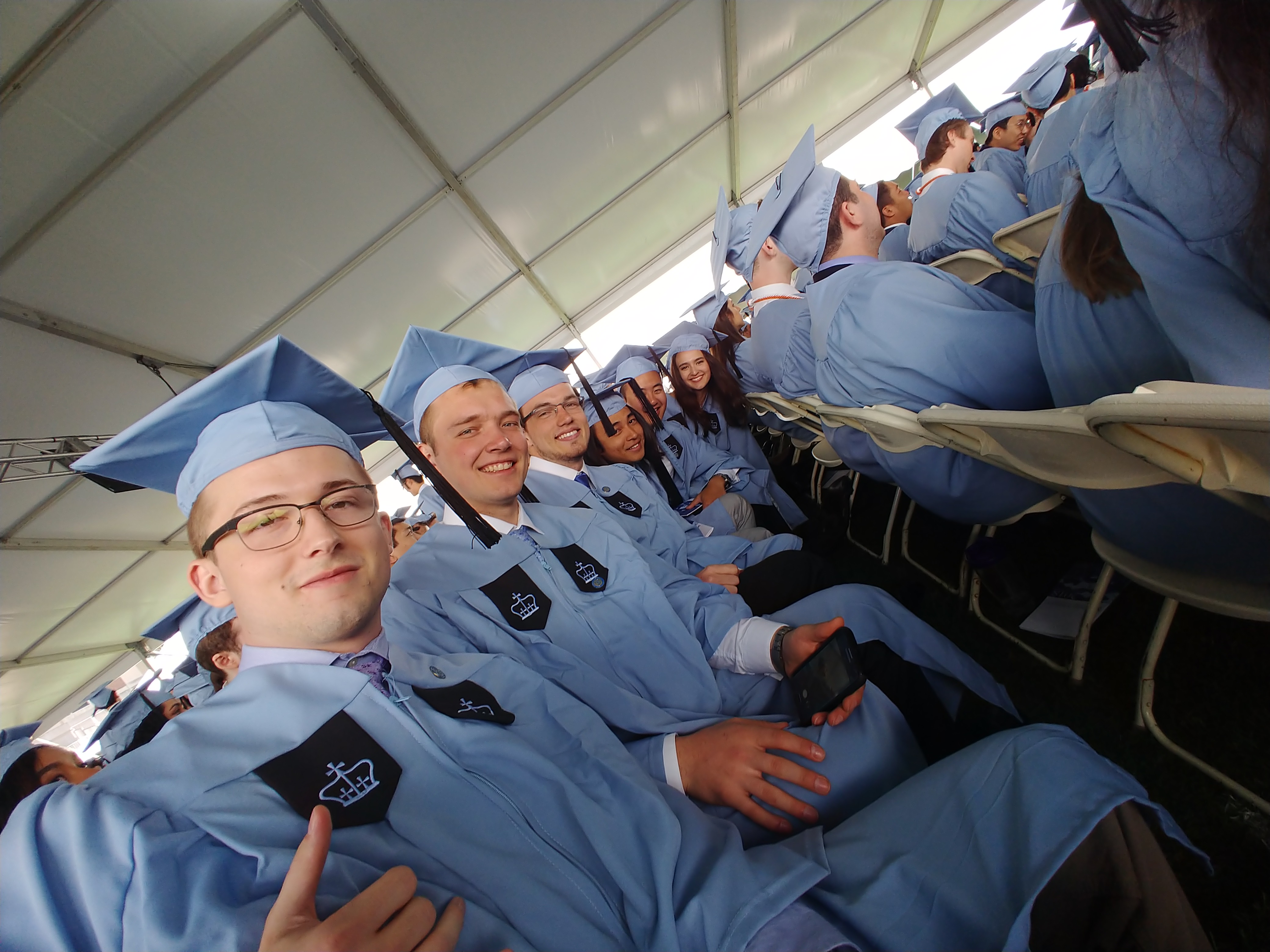 Maxum Smith at Columbia University commencement — Columbia-blue cap and gown among the graduating class