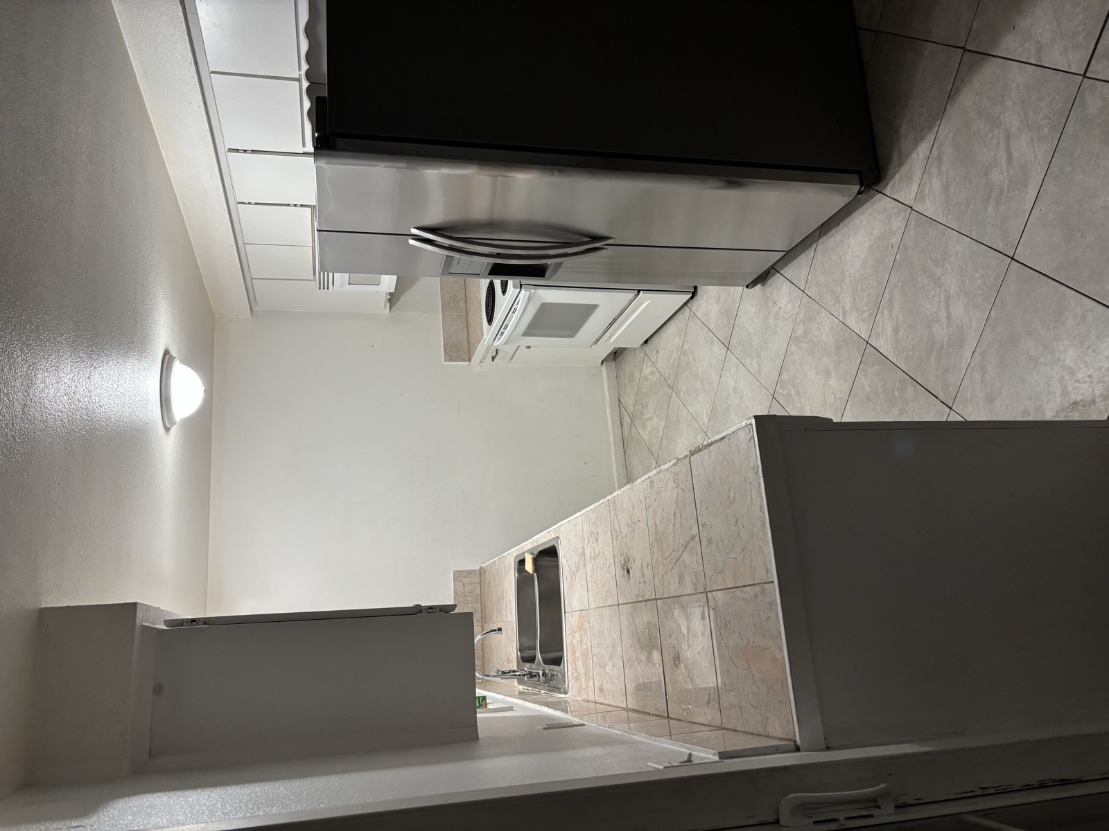 316 Noel Ave kitchen before — dated tile countertops